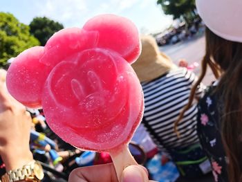 Close-up of hand holding ice cream