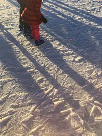 Low section of child walking on floor