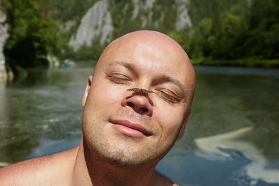 Close-up portrait of man in swimming pool