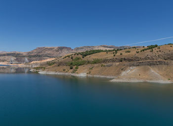 Scenic view of mountain against clear blue sky