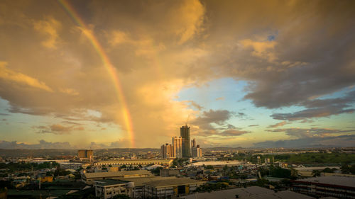 High angle view of buildings against sky during sunset