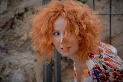 Close-up of woman looking away while standing outdoors