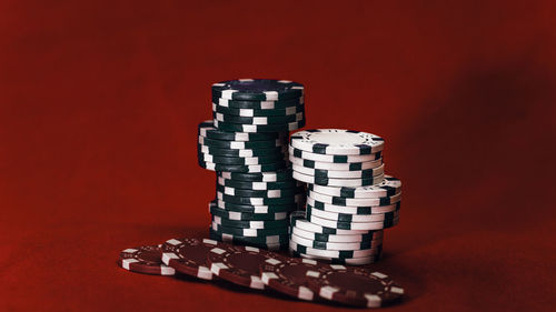 Close-up of dices on red background