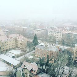 High angle view of city during snowfall