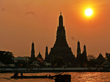 Silhouette of temple against sky during sunset