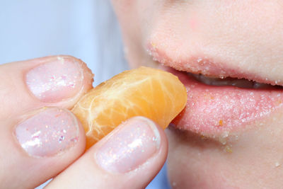 Close-up of hand holding ice cream