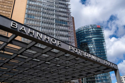 Low angle view of modern buildings against sky in city