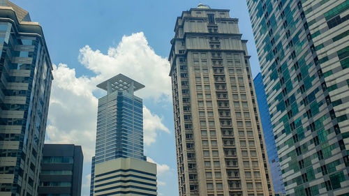 Low angle view of modern buildings against sky