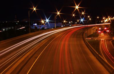 High angle view of light trails on road at night