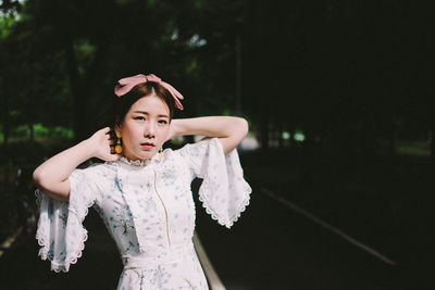 Portrait of woman standing outdoors