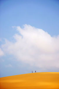 Distance view of people on sand dune at mui ne