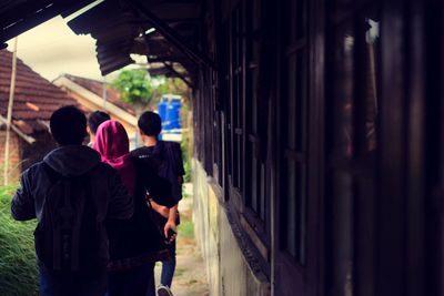 Rear view of friends at temple