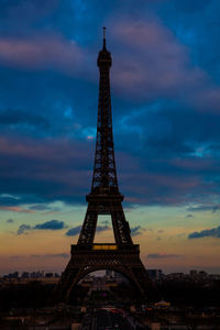 Low angle view of tower against cloudy sky