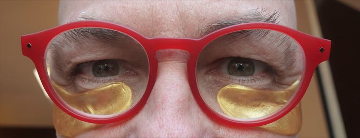 Close-up portrait of man wearing eyeglasses