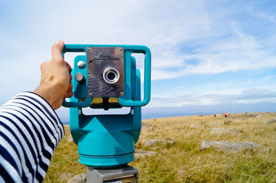 Person holding binoculars
