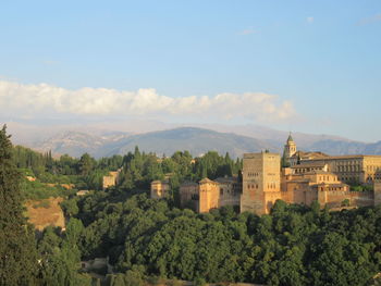 High angle view of houses and mountains against sky