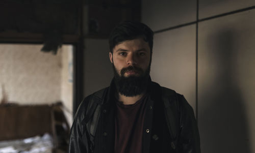 Portrait of bearded man at home