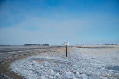 Scenic view of landscape against blue sky