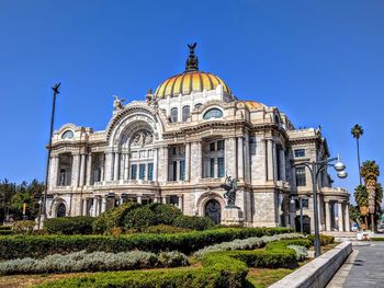 Low angle view of building against blue sky