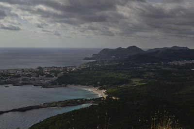Scenic view of cala agulla against sky