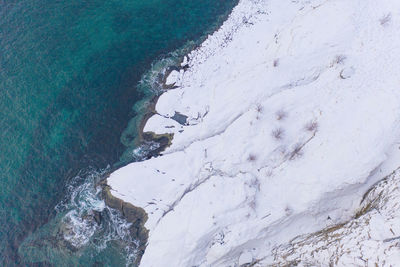 High angle view of rocks in sea