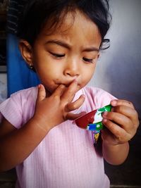 Close-up of girl eating food