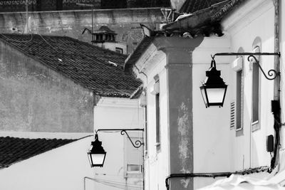 Low angle view of lantern hanging outside house