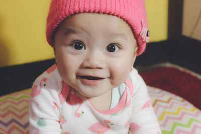 Portrait of cute baby girl at home