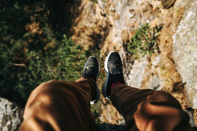 Low section of man on rock