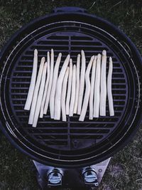 Low section of man standing on barbecue grill