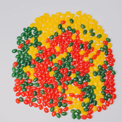 Close-up of multi colored candies against white background