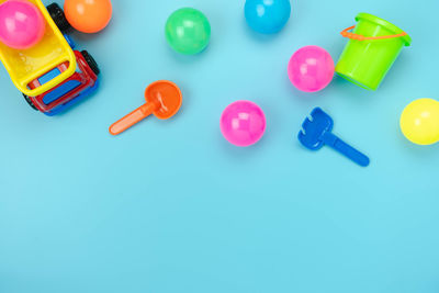 High angle view of toys against blue background