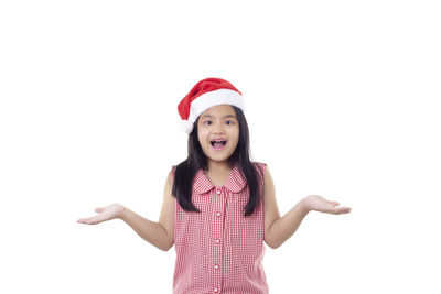 Smiling girl standing against white background