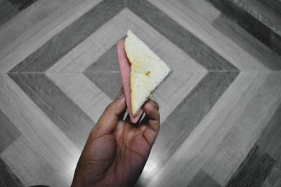 Close-up of hand holding bread