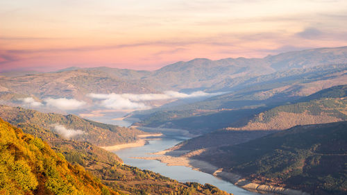 Scenic view of mountains against sky during sunset