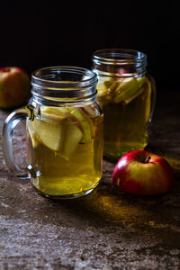 Close-up of fruits in jar on table