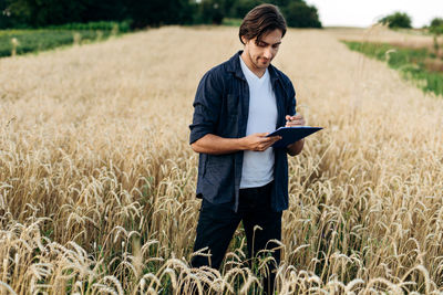 Full length of man standing on field