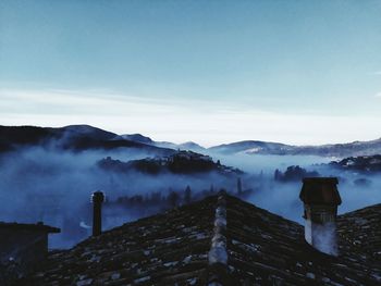 Scenic view of mountains against sky during winter