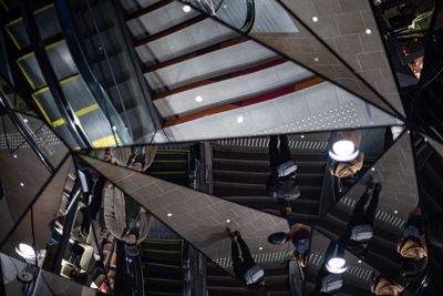 Low angle view of illuminated lighting equipment hanging on ceiling