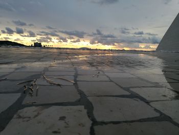 Scenic view of beach against sky during sunset