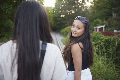 Happy female friends spending time together outdoors