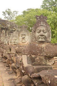 Statue of buddha against trees