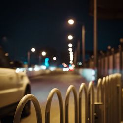 Close-up of illuminated street lights at night