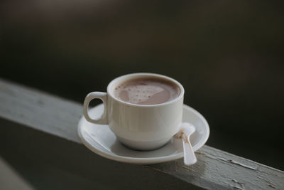 High angle view of coffee cup on table