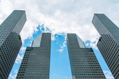 Low angle view of modern buildings against sky