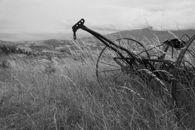 Bicycle on field against sky