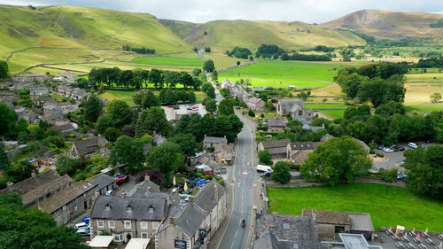 High angle view of trees and buildings in city