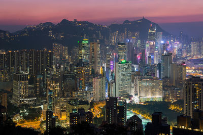 High angle view of illuminated city buildings at night