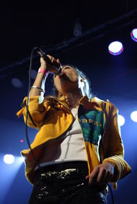 Low angle view of woman singing at nightclub