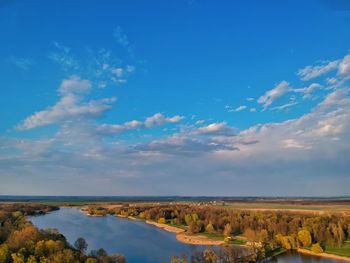 Scenic view of landscape against blue sky